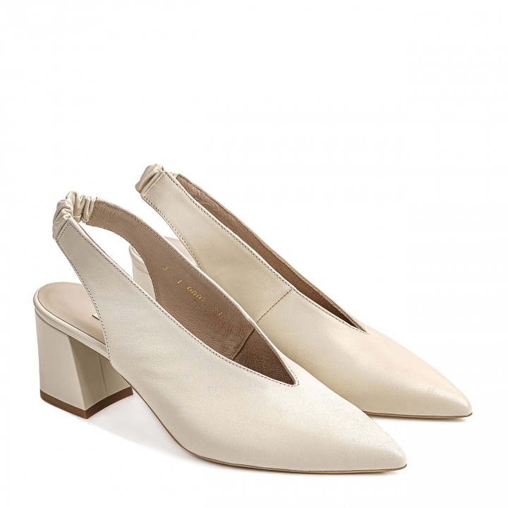 Cream women's pumps with an open heel and a pointed toe