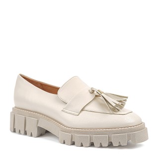Elegant cream-colored moccasins with embellishments