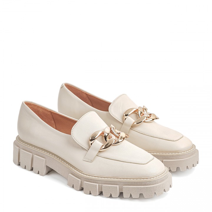 Cream moccasins with a thick sole
