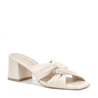 Cream-colored leather slides on a block heel