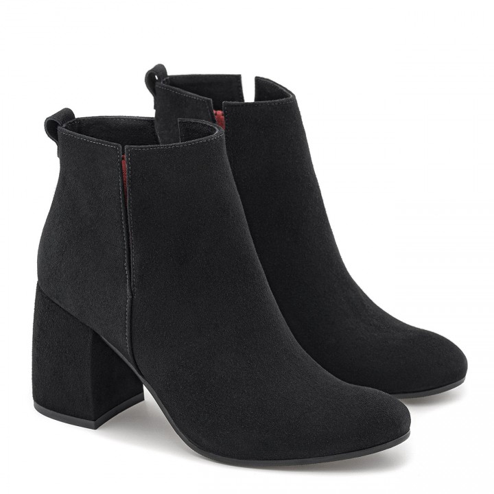 Black suede ankle boots with cutouts in the upper