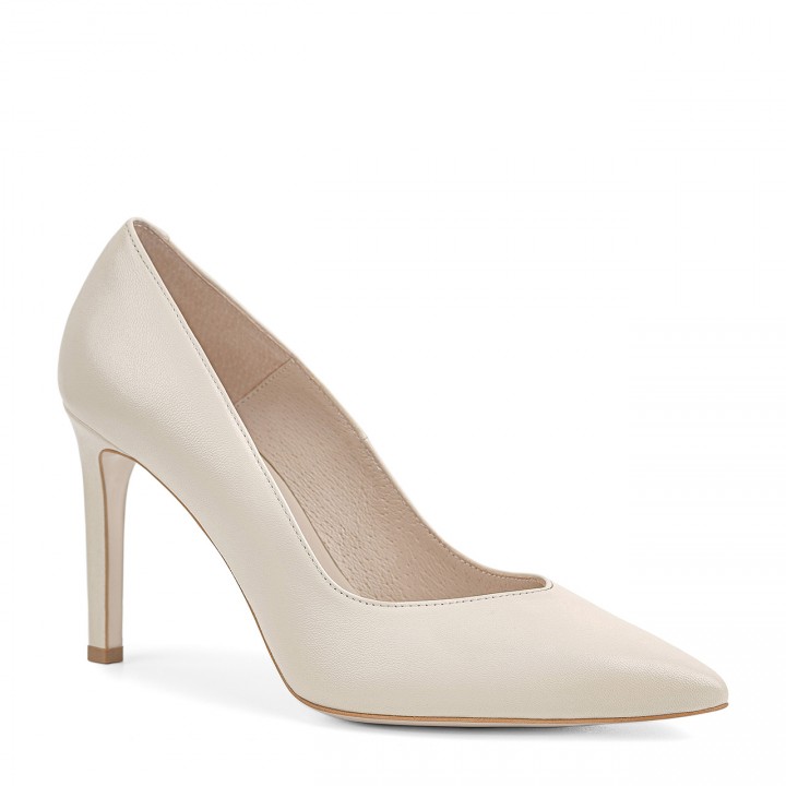 Cream stilettos made of natural grain leather with a high heel and a pointed toe