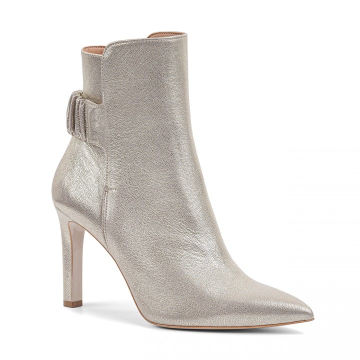 Gold leather ankle boots with an elastic band on the heel