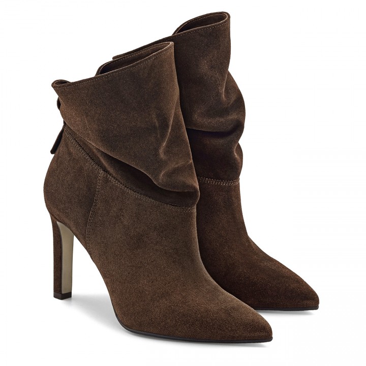 Stiletto-heeled brown velour ankle boots featuring a relaxed shaft
