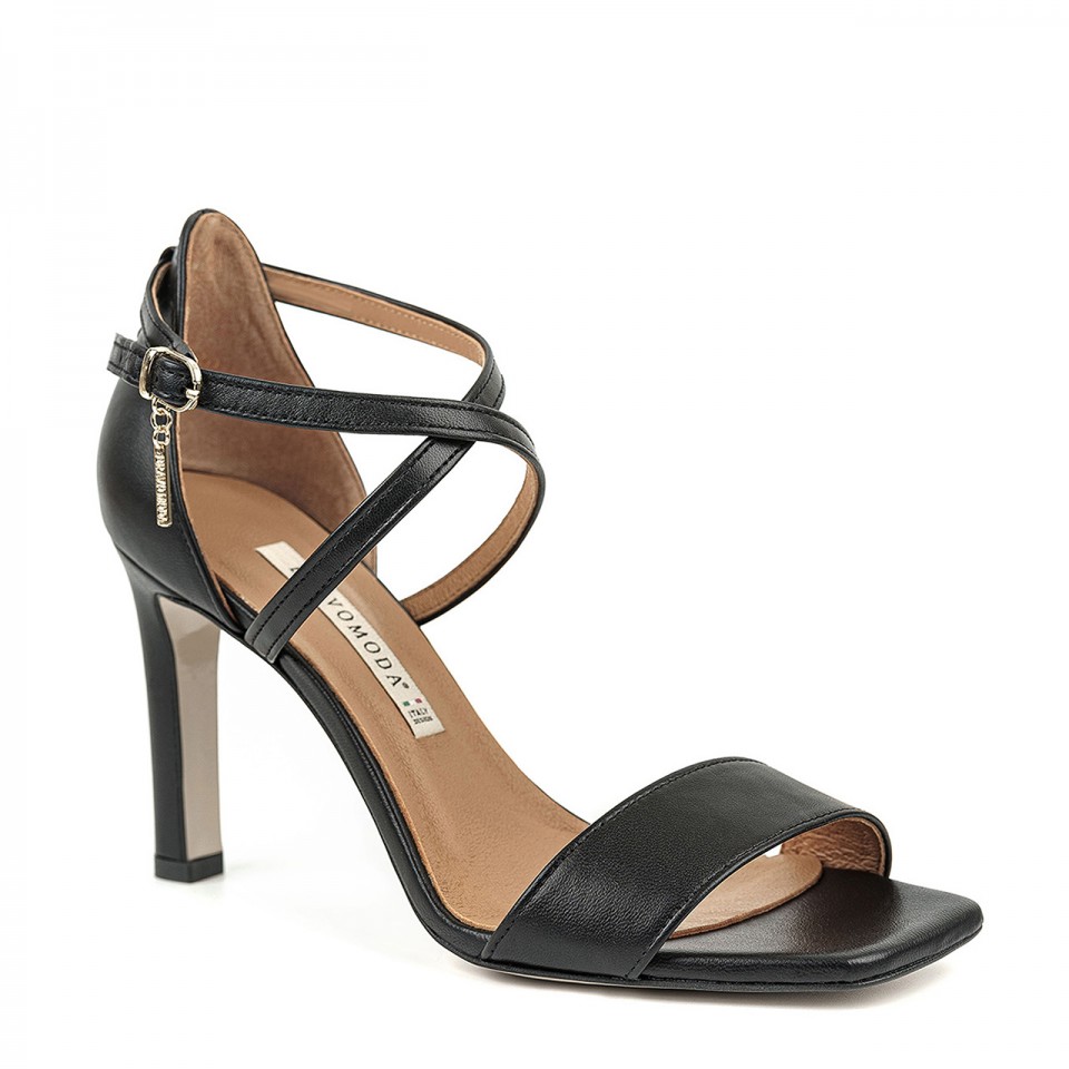 Black leather high-heeled sandals with crossed straps and a square toe