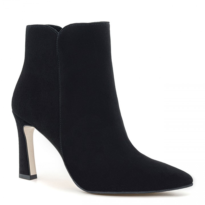 Black suede ankle boots with a geometric, narrow heel