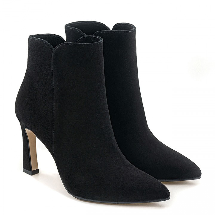 Black suede ankle boots with a geometric heel