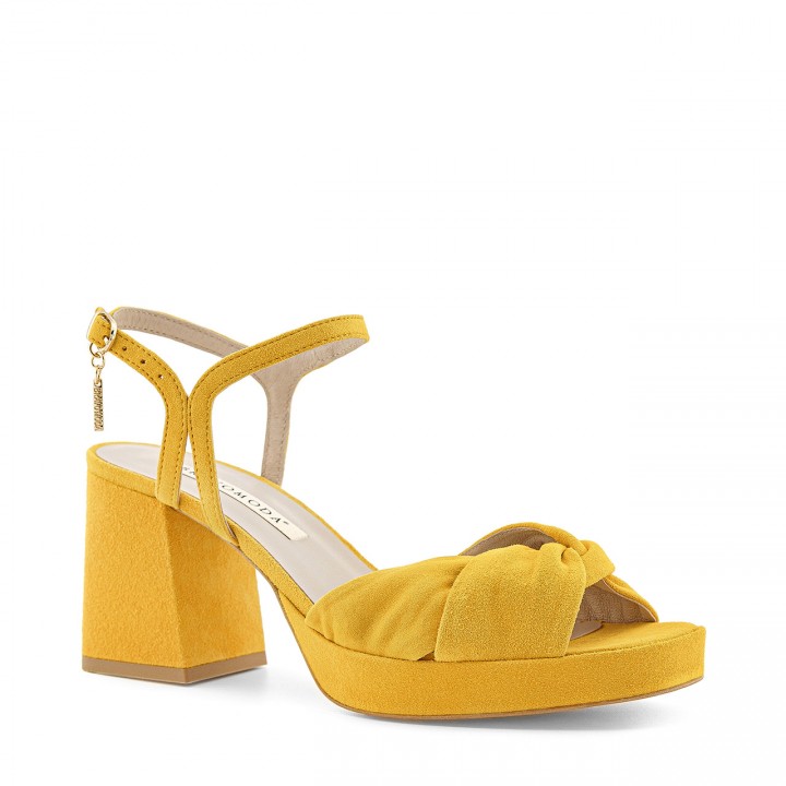 Yellow sandals made from genuine suede leather with a platform and a stable heel
