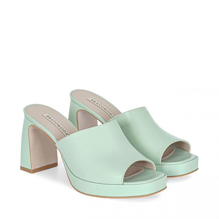 Leather slides with a platform and a stable block heel in pistachio color