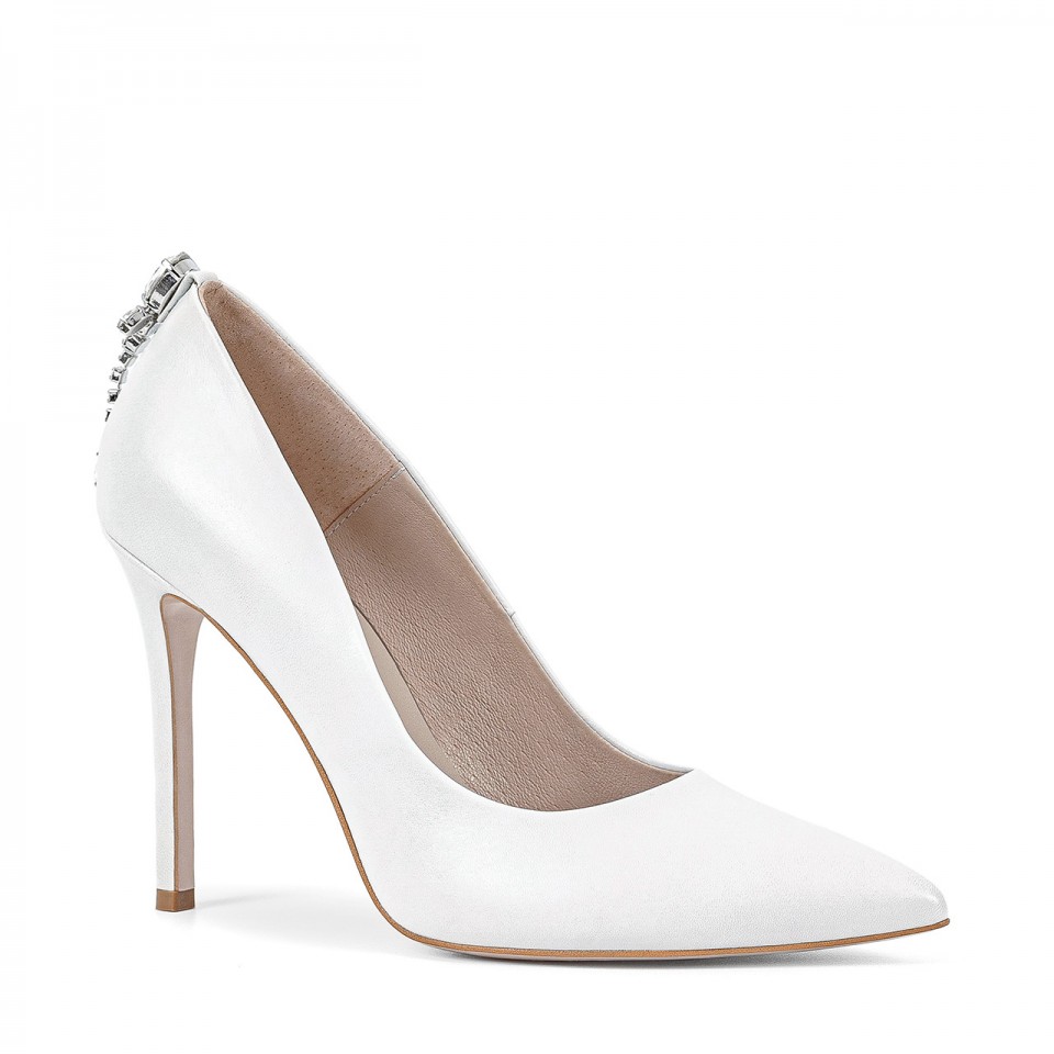 White leather stiletto pumps with a shiny ornament on the heel