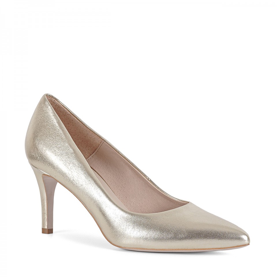 Golden pumps made of natural grain leather with a comfortable heel and pointed toes