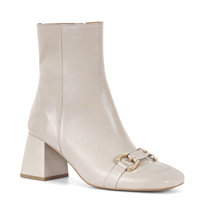 Ankle boots with square toes and a golden ornament