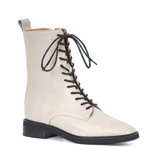 Subtle lace-up ankle boots made of natural, ivory-colored grain leather