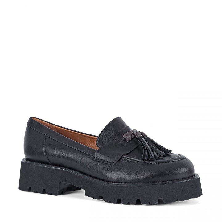Black moccasins with a thick sole made of natural grain leather