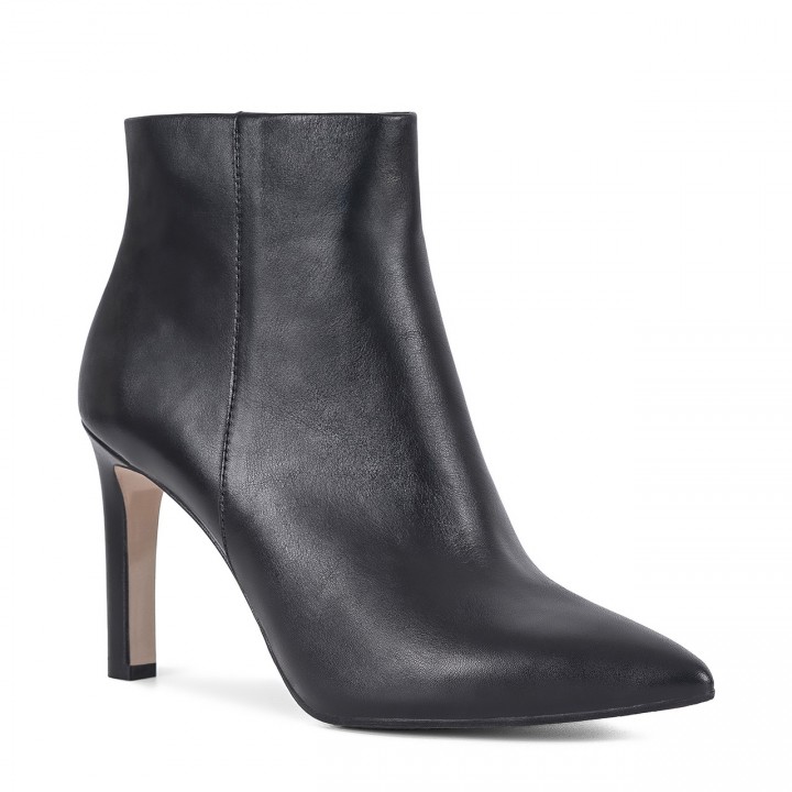 Black classic women's ankle boots with a high heel made of natural grain leather