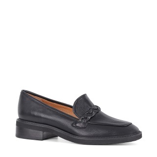 Black moccasins made of natural goat leather with a flat sole