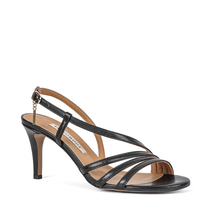 Black sandals made of natural goat leather with decorative straps on a high heel