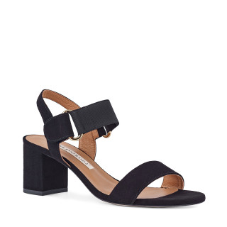 Black sandals made of natural suede leather on a high heel, fastened with velcro