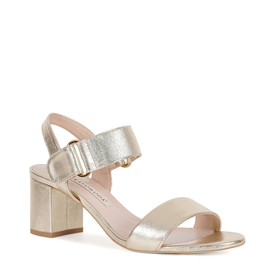 Golden sandals made of natural goat leather on a high heel with a comfortable fastening