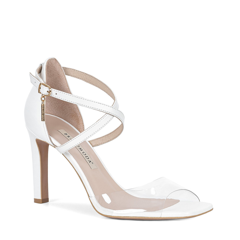 White leather sandals on high heels with transparent toes on the front