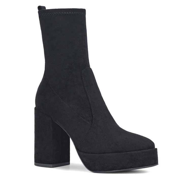 Black platform heel ankle boots with a fitted upper