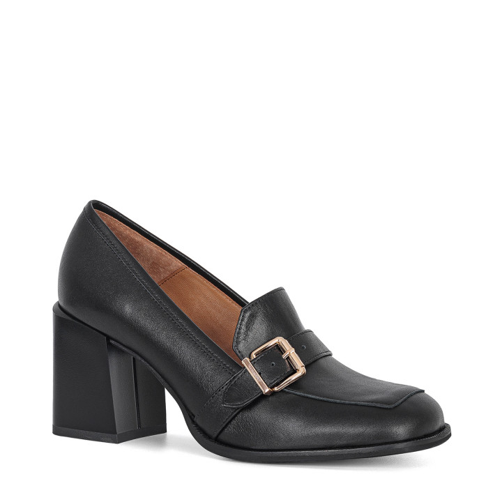 Black leather loafers with a gold buckle and a stable heel