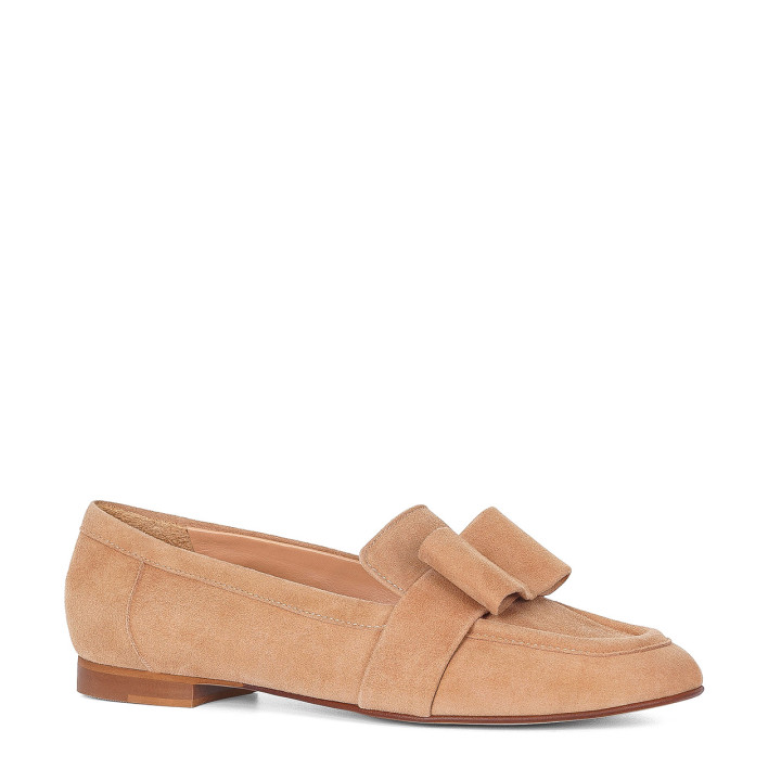 Toffee-colored suede moccasins with a decorative bow on the front