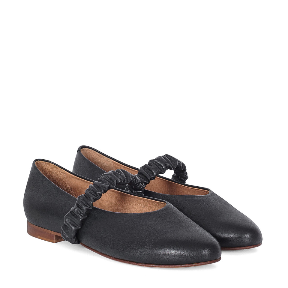 Black leather ballet flats