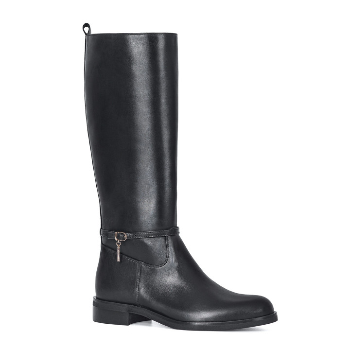 Black boots with a flat sole made of natural grain leather