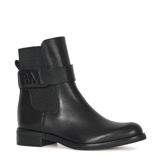 Black leather ankle boots with a flat sole and decoration