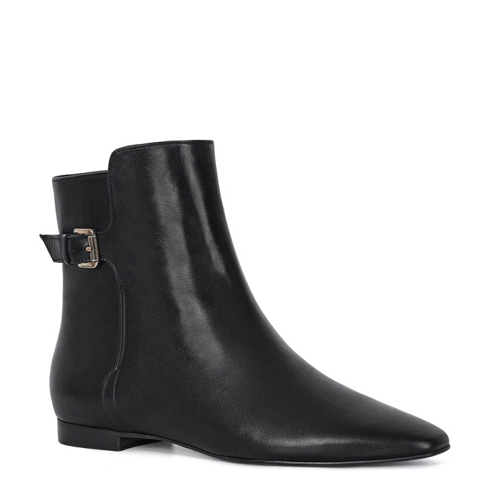 Black boots with a flat sole and square toes made of natural grain leather