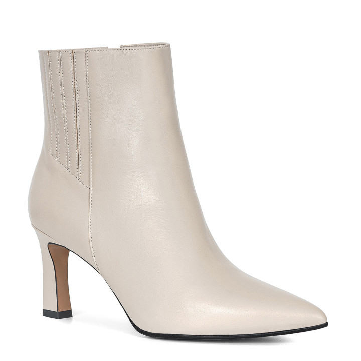 Elegant leather ankle boots with a geometric heel and decorative stitching