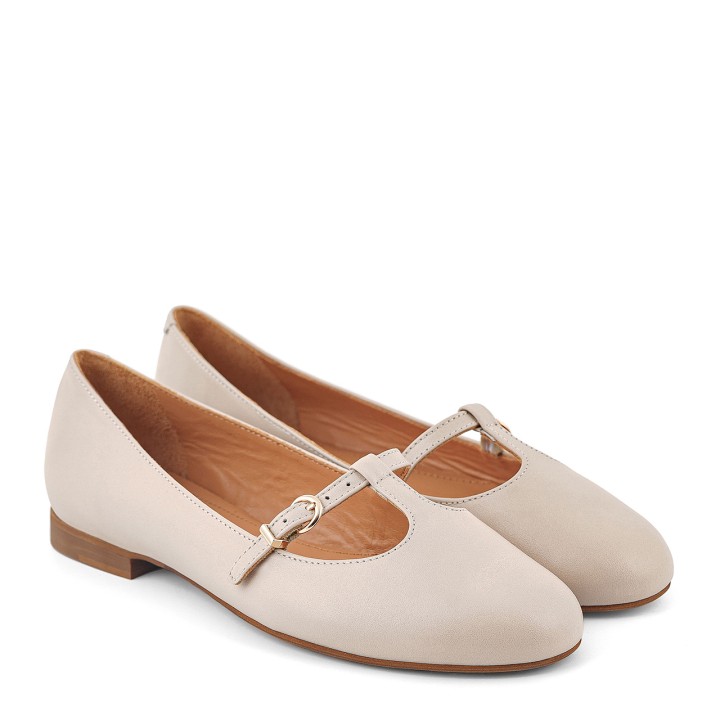 Cream ballet flats with a rounded toe